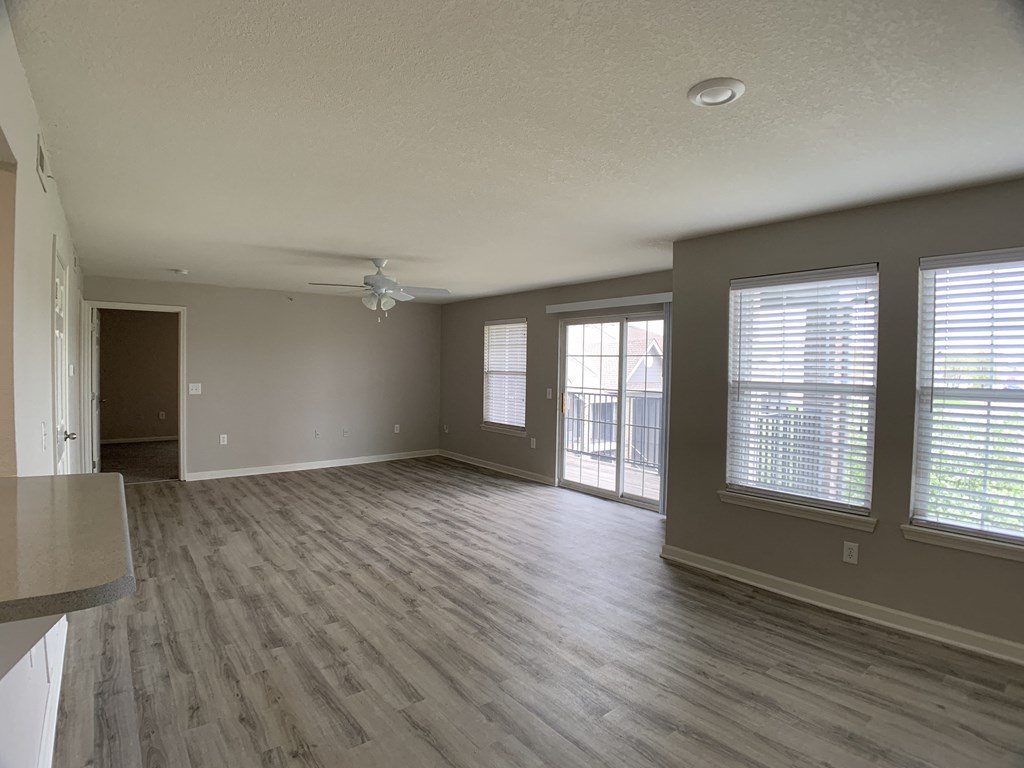 Living room with open floor plan at Saddlewood in Olathe, KS