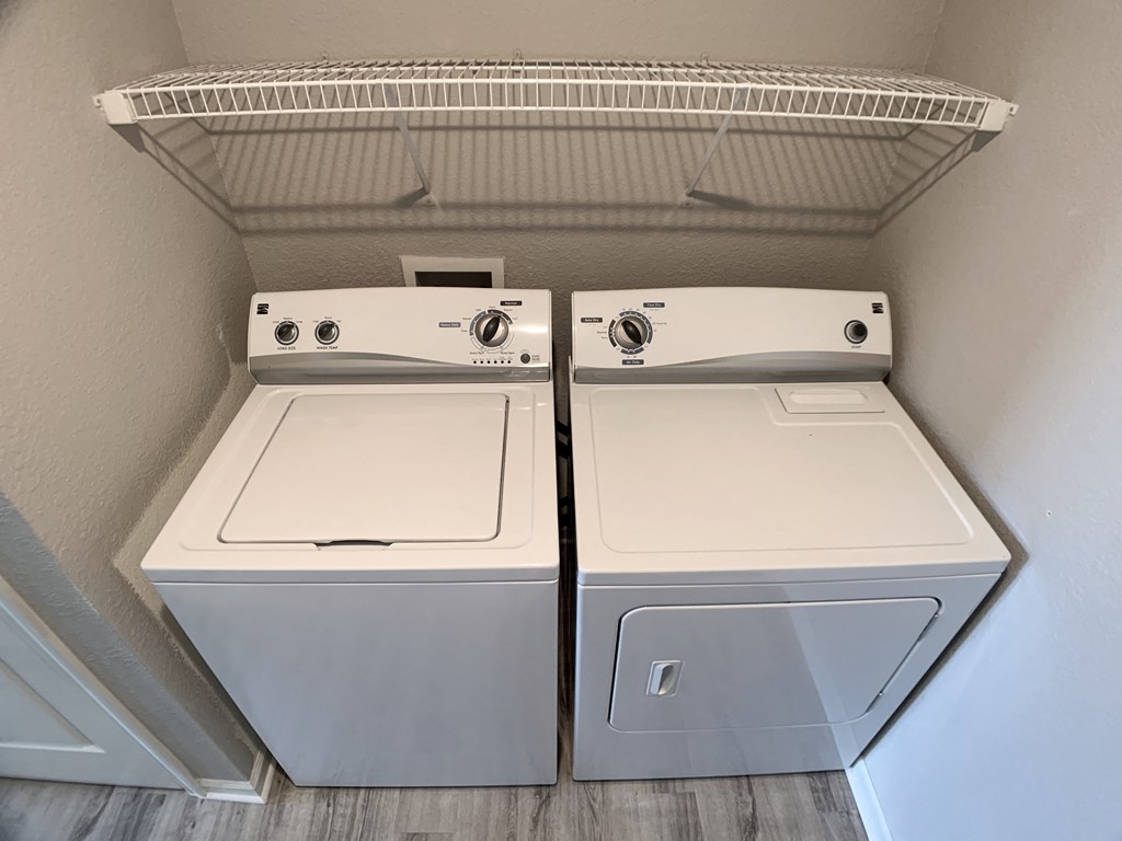 Washer and dryer in closet at Saddlewood in Olathe, KS