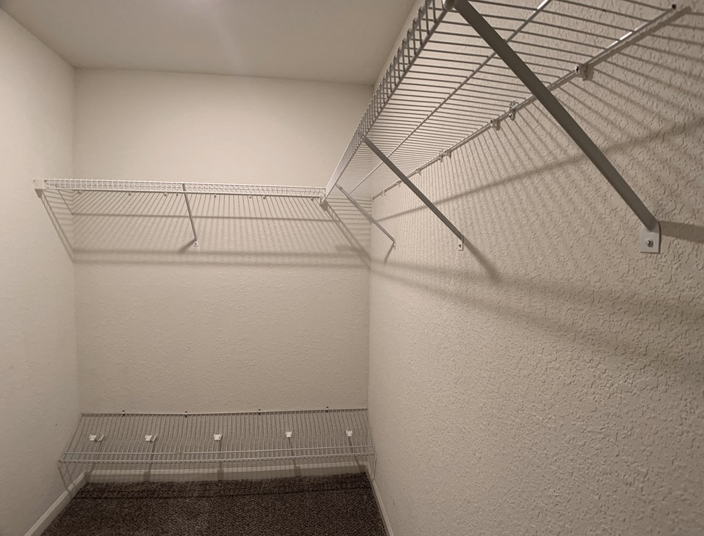Closet with shelves at Saddlewood in Olathe, KS
