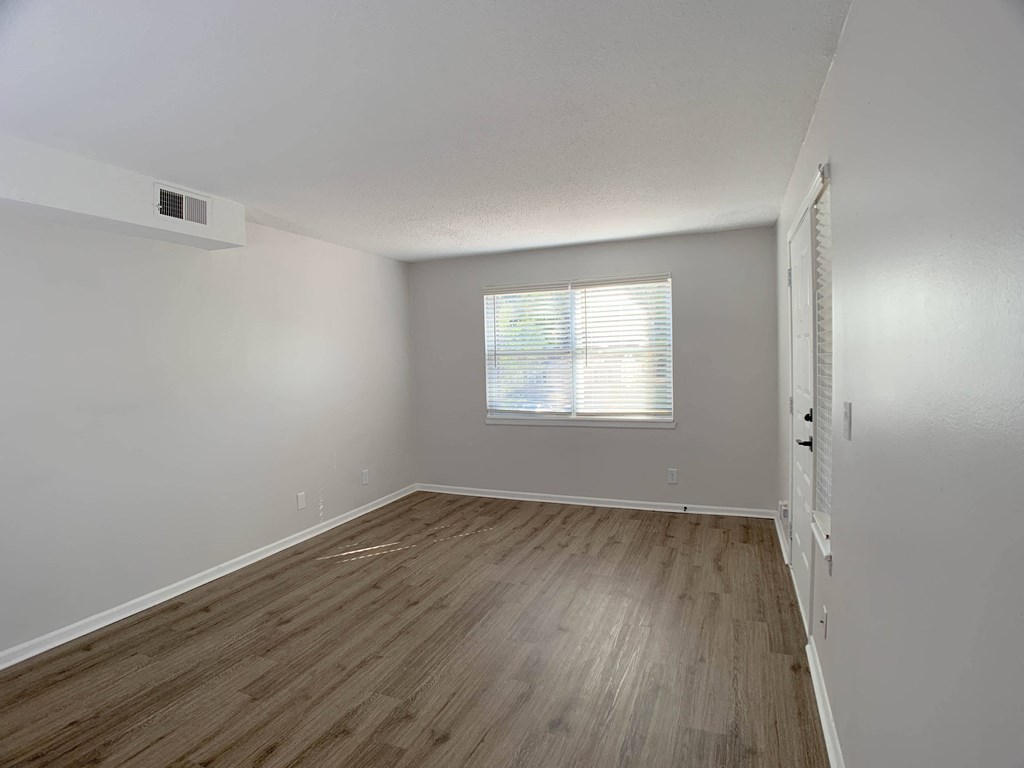 Photo of entryway to unit with vinyl flooring and window facing the sun in Kansas City.
