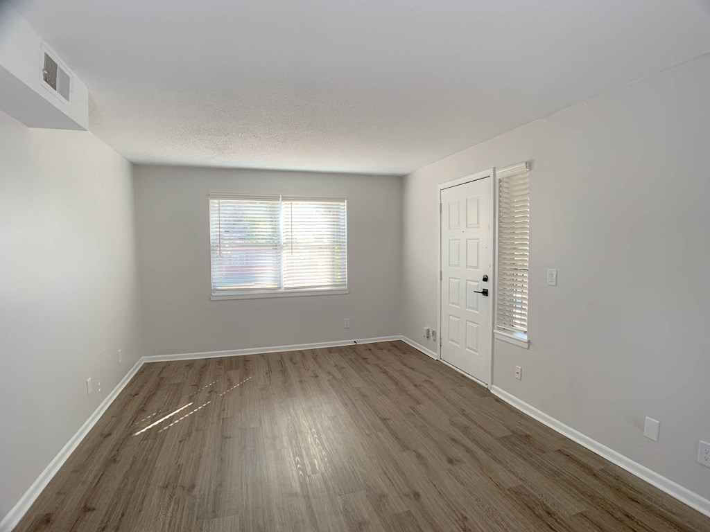 Photo of entryway to unit with vinyl flooring and window facing the sun in Kansas City.