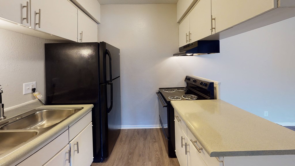 large kitchen with appliances and plenty of cabinet space