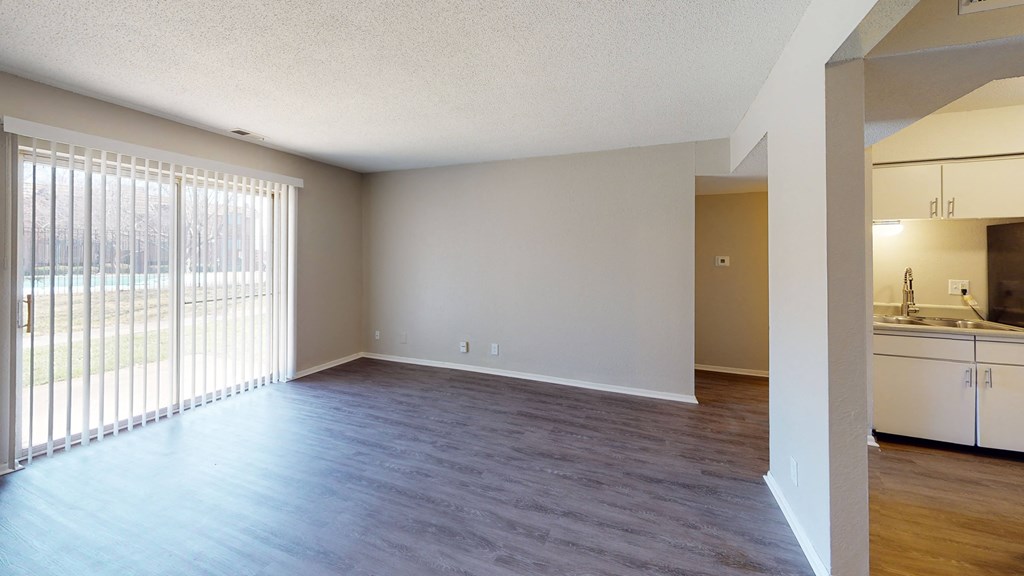 large open room with vinyl plank flooring