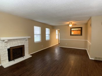 living room with wood floors and fireplace - Photo Gallery 3