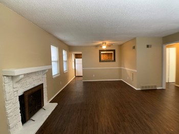 large living room with wood floors and fireplace - Photo Gallery 2