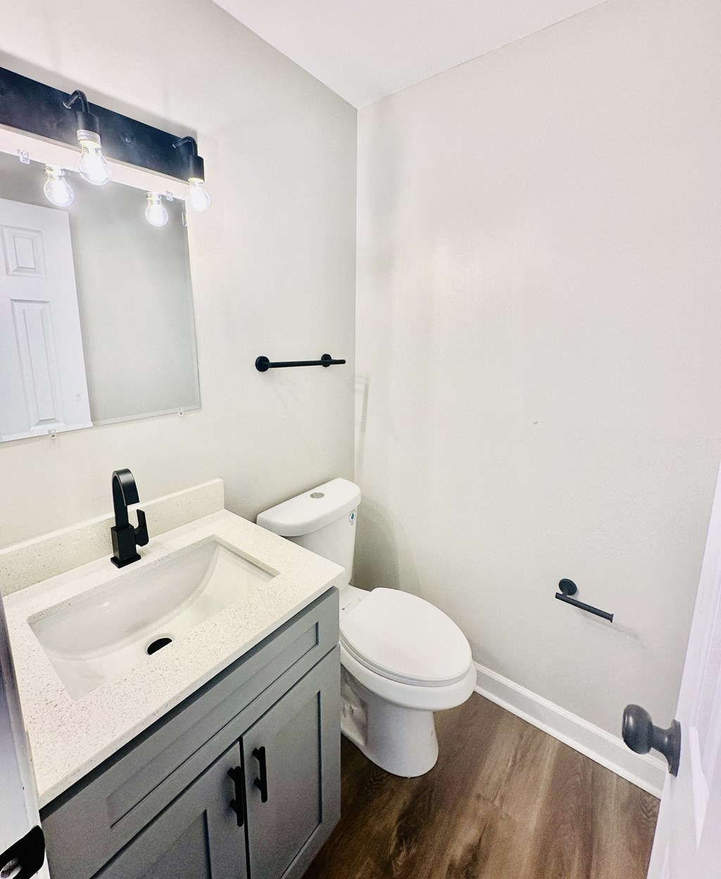 an empty bathroom with a sink and a toilet