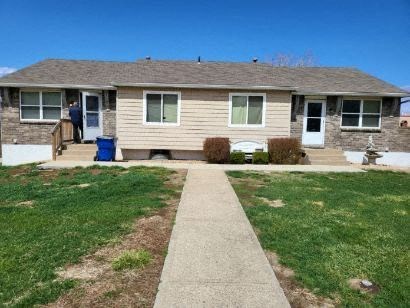 exterior of duplex with sidewalk