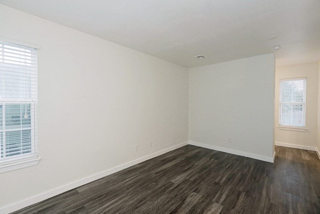 a bedroom with hardwood floors and white walls at Bennett Ridge Apartments, Oklahoma City, 73132