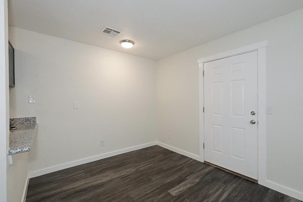 a bedroom with hardwood flooring and white walls at Bennett Ridge Apartments, Oklahoma City, OK, 73132