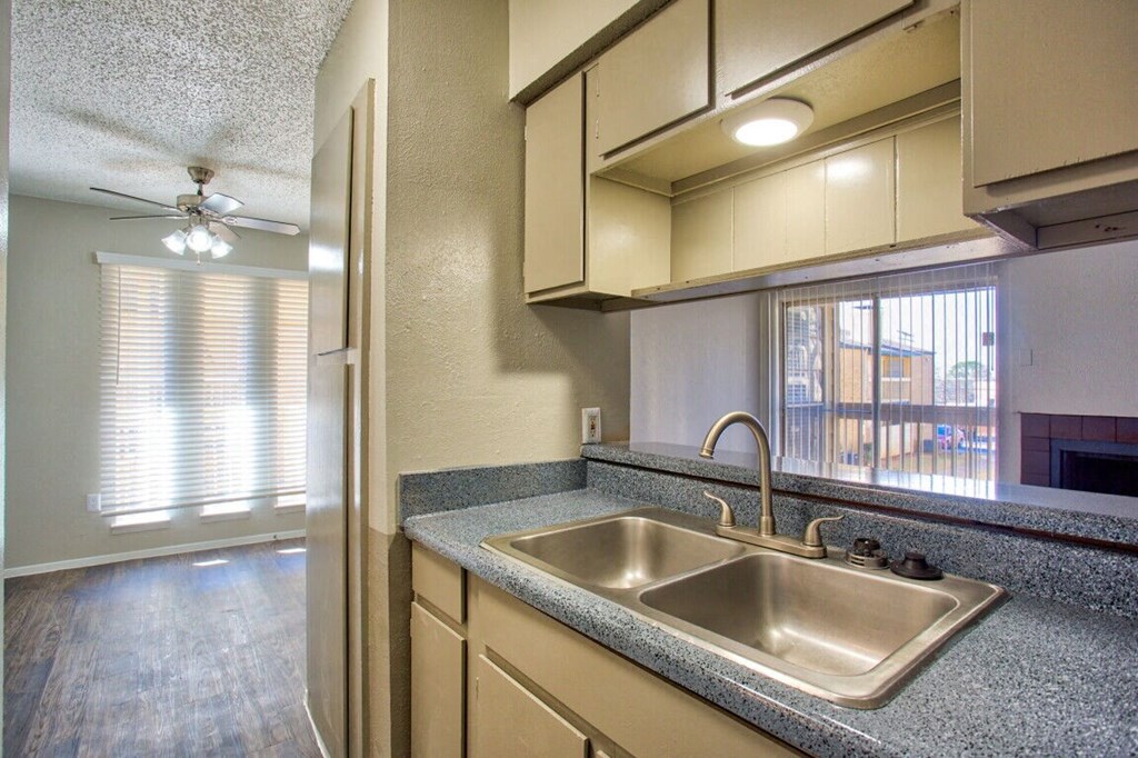 a kitchen with a sink and a window
