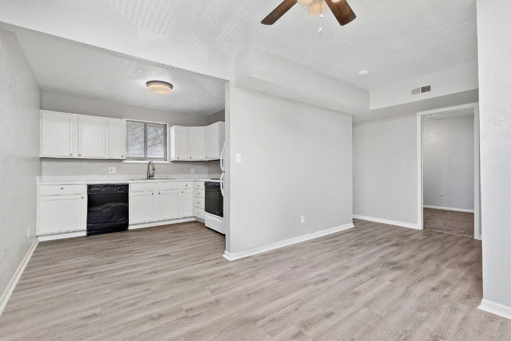 full sized kitchen with appliances and living room