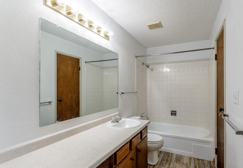 a bathroom with a sink toilet and bathtub