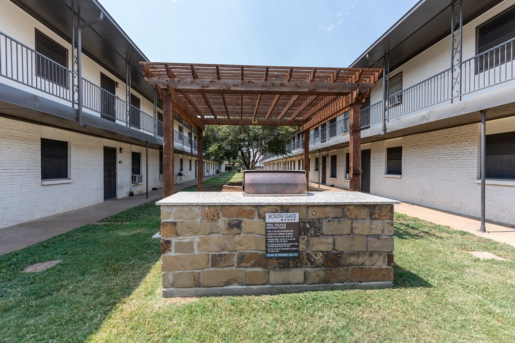 A sign in front of a building says "SOURCE".