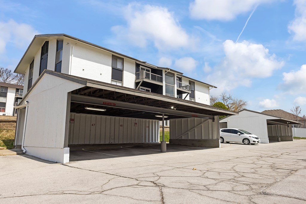 a garage with a car parked in front of it