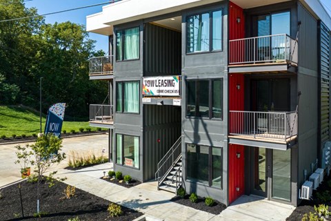 A multi-story building with a sign that says