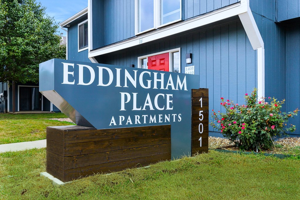 a blue building with a sign that says eddingham place apartments