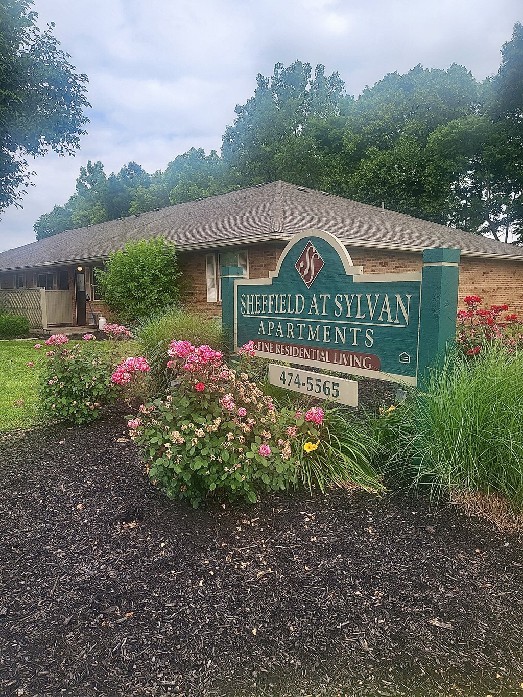 Property sign with flowers at Sheffield at Sylvan in Ohio