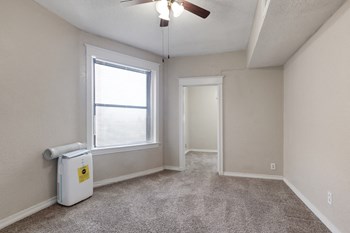 large carpeted room with ceiling fan - Photo Gallery 7