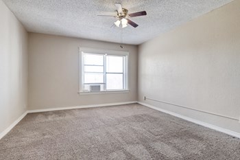 large carpeted room with ceiling fan - Photo Gallery 8