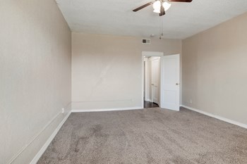 large carpeted room with ceiling fan - Photo Gallery 6