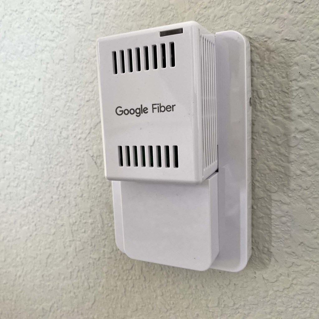 A Google Fiber box mounted on a wall.