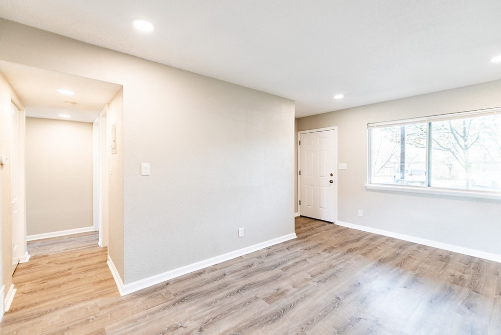 A room with a window and a door.