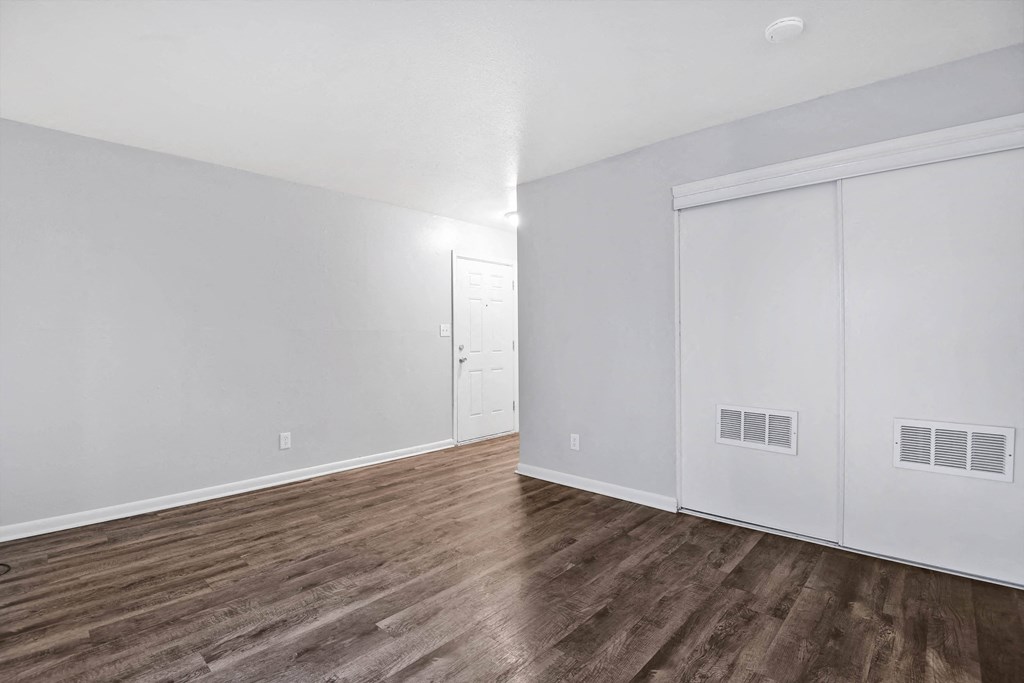 large room with hardwood floors