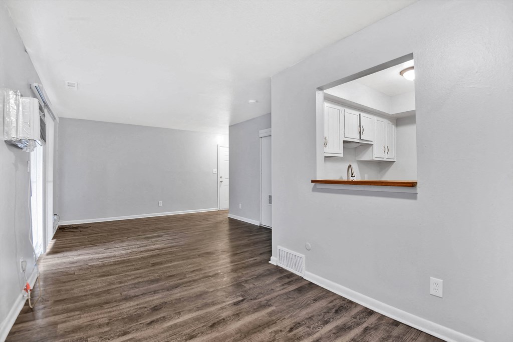 large room with hardwood floors
