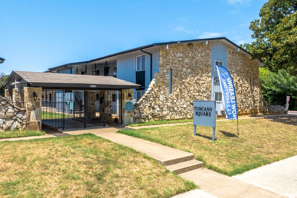 a building with a blue sign in front of it