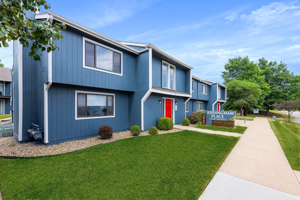 a blue building with a red door
