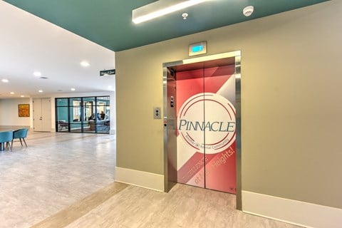 the lobby of a pinnacle gym with a pina cola sign on the door at Pinnacle Apartments, Jacksonville, Florida