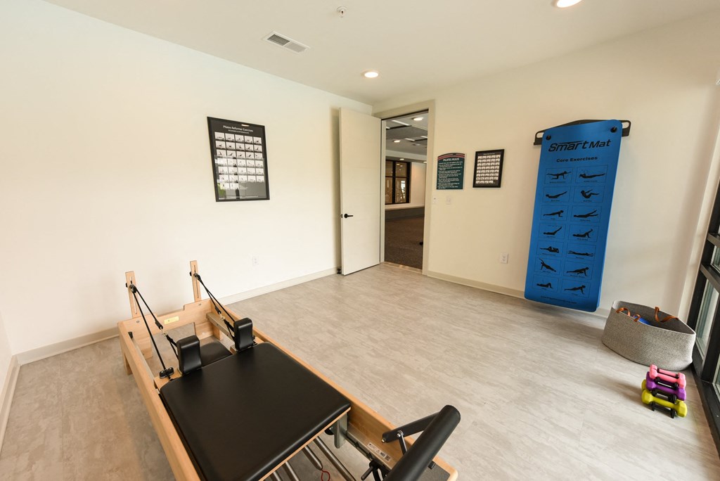 a conference room with a desk and a large blue punching bag at Pinnacle Apartments, Jacksonville, FL