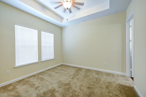 Bedroom with a Ceiling Fan and Two Windows  at Alaqua, Jacksonville, FL, 32258