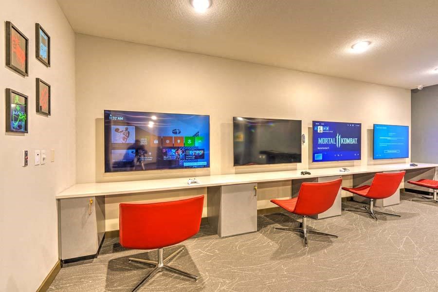 a room with three televisions on the wall  at Fusion, Jacksonville, FL, 32256