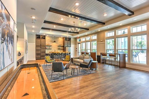 a large room with couches and chairs and a pool table  at Fountainhead, Jacksonville