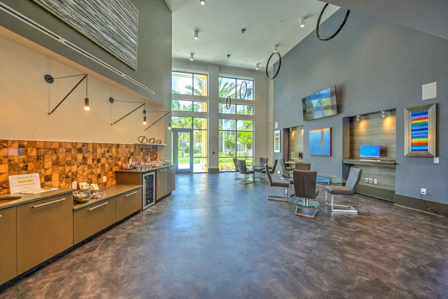 a large lobby with a reception desk and chairs and a large window with a view of the  at Fusion, Florida, 32256