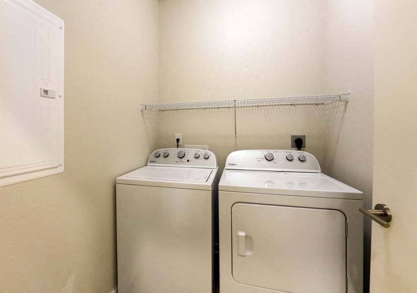 a washer and dryer in a room  at Fusion, Jacksonville, 32256