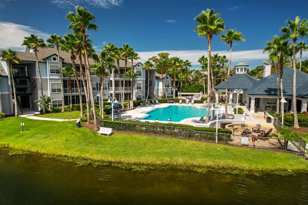 a large swimming pool with palm trees in the background  at Ocean Park, Florida