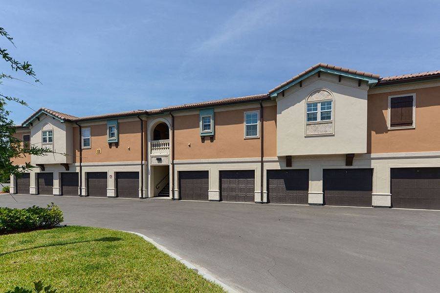 a building with a parking lot in front of it  at Hacienda Club, Florida