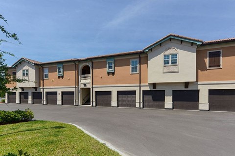 a building with a parking lot in front of it  at Hacienda Club, Florida