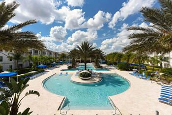 a large pool with a fountain in the middle of it  at Palm Bay Club, Jacksonville, FL