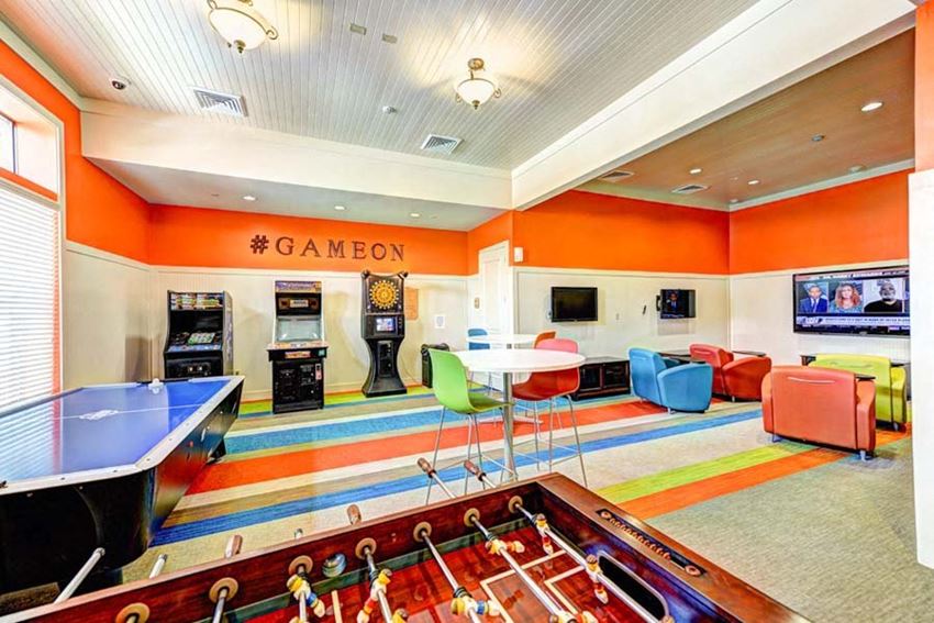 Game Room a game room with a foosball table and a ping pong table at Hacienda Club, Jacksonville, Florida