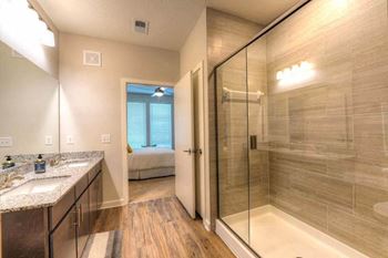 a bathroom with a shower and a sink  at Fusion, Jacksonville, 32256