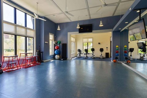 a room with a bunch of exercise equipment in it  at Cabana Club - Galleria Club, Jacksonville, FL, 32256