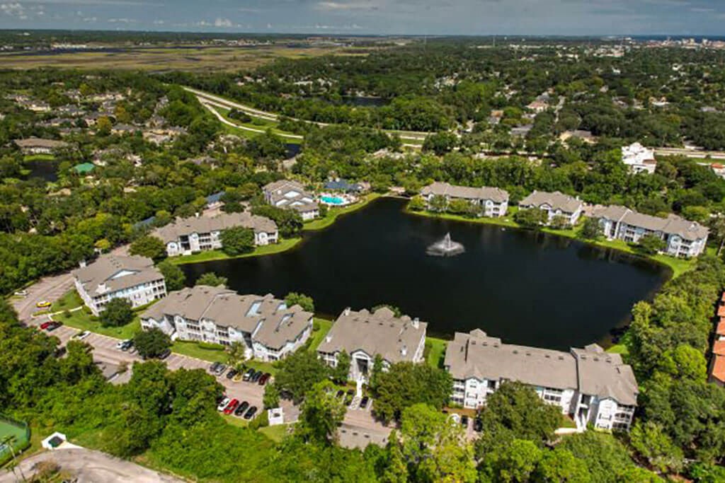 an aerial view of a lakeside community with a sailboat in the lake  at Ocean Park, Jacksonville Beach, 32250