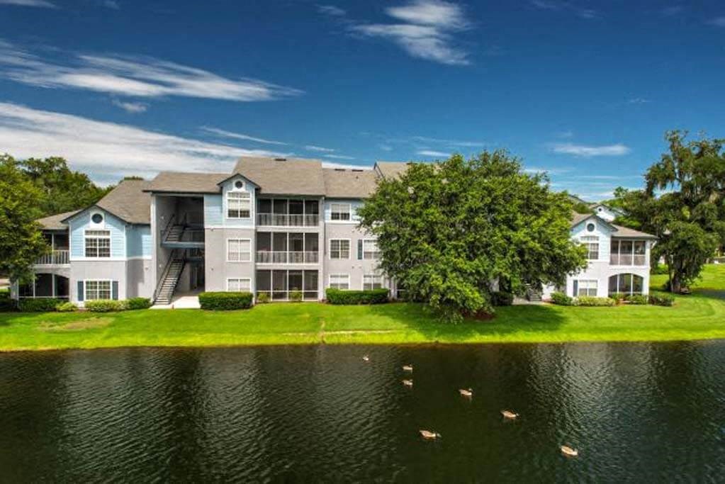 a building with a large pond in front of it  at Ocean Park, Florida, 32250
