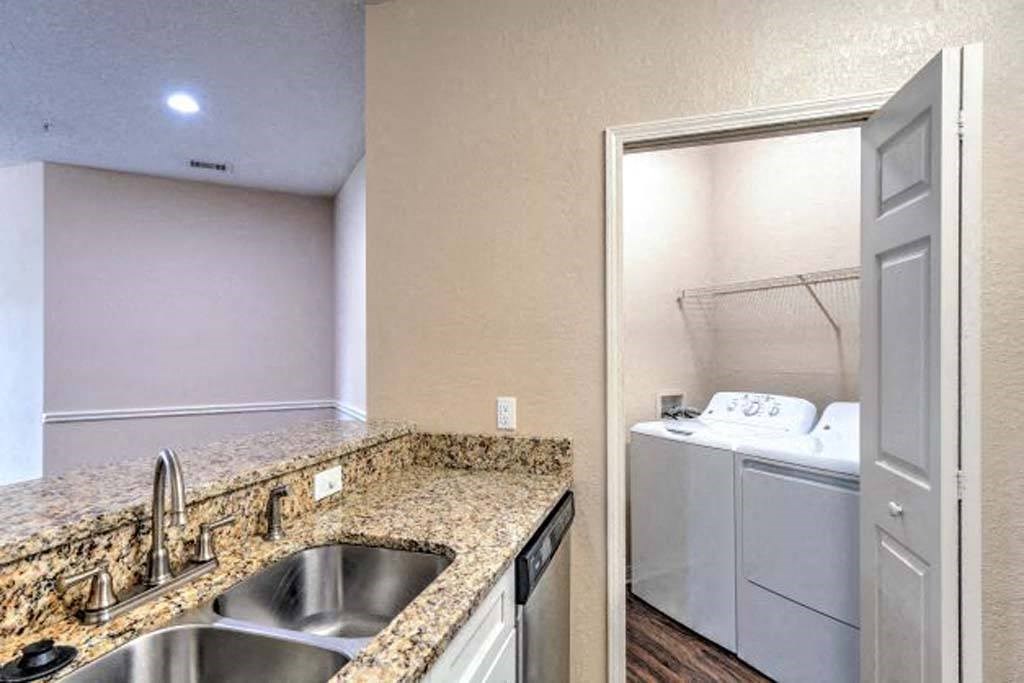 a kitchen with a sink and a washer and dryer  at Ocean Park, Florida