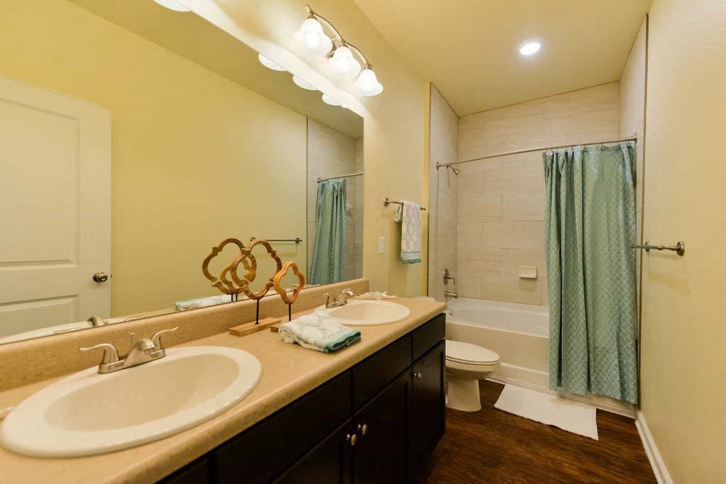 a bathroom with a sink and a toilet  at Cabana Club - Galleria Club, Florida, 32256