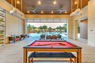 a pool table at amphora resort luxury private apts  at Luxor Club, Jacksonville, FL, 32258 - Photo Gallery 5