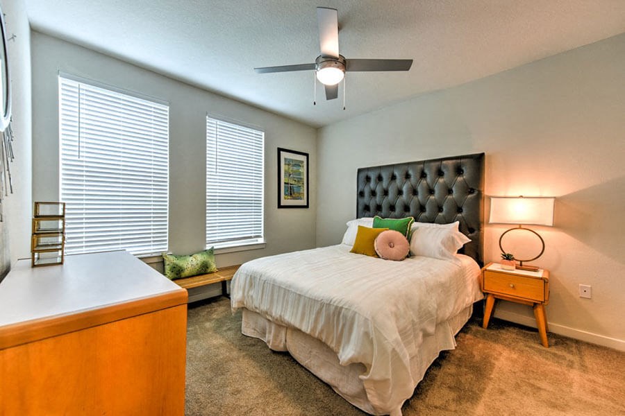 a bedroom with a bed and two windows  at Fusion, Jacksonville, FL, 32256